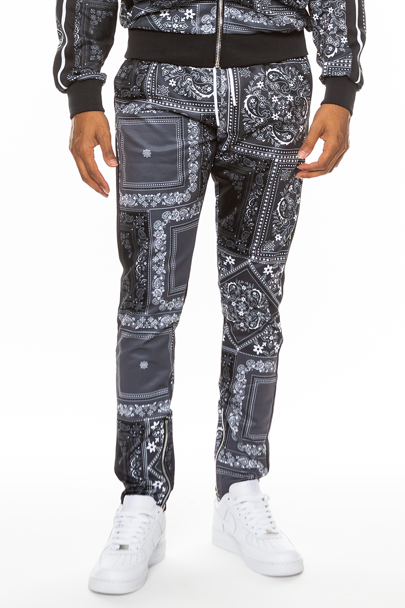 Stylish paisley all over print pants with elastic waist and ankle zippers, perfect for casual and dressy occasions.