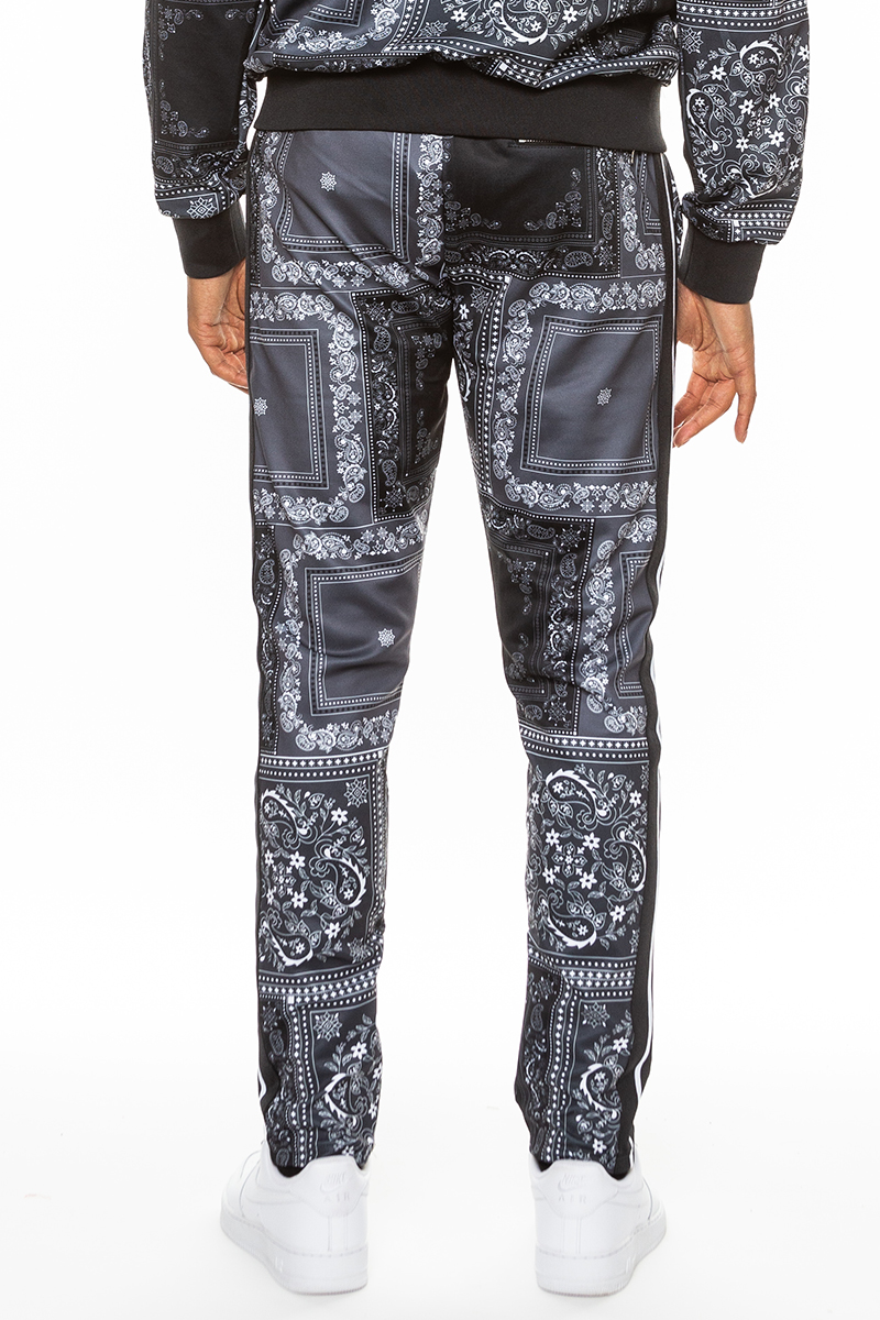 Stylish paisley all over print pants with elastic waist and ankle zippers, perfect for casual and dressy occasions.