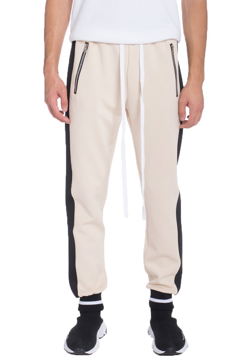 Rally Heavy Weight Jogger in two-tone design, featuring elastic waist and ankle cuffs, perfect for workouts and casual wear.