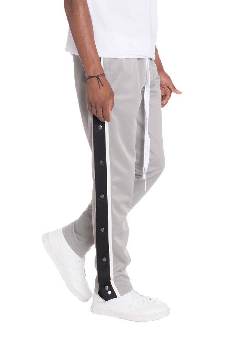 A pair of stylish Snap Button Track Pants featuring a straight fit, side snap buttons, and standard pockets, perfect for casual and active wear.