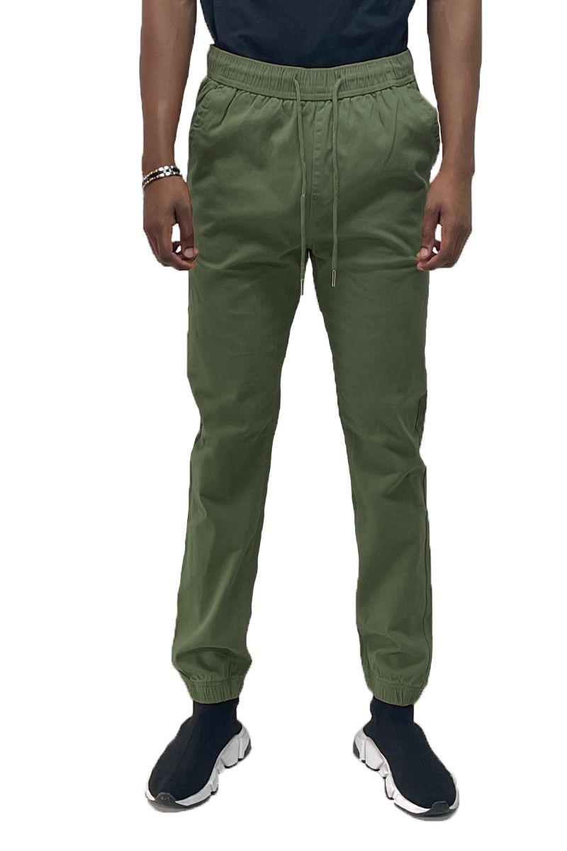 A pair of stylish Solid Jogger Pants featuring an elastic waist and ankle, with standard and back pockets, made from soft cotton blend fabric.