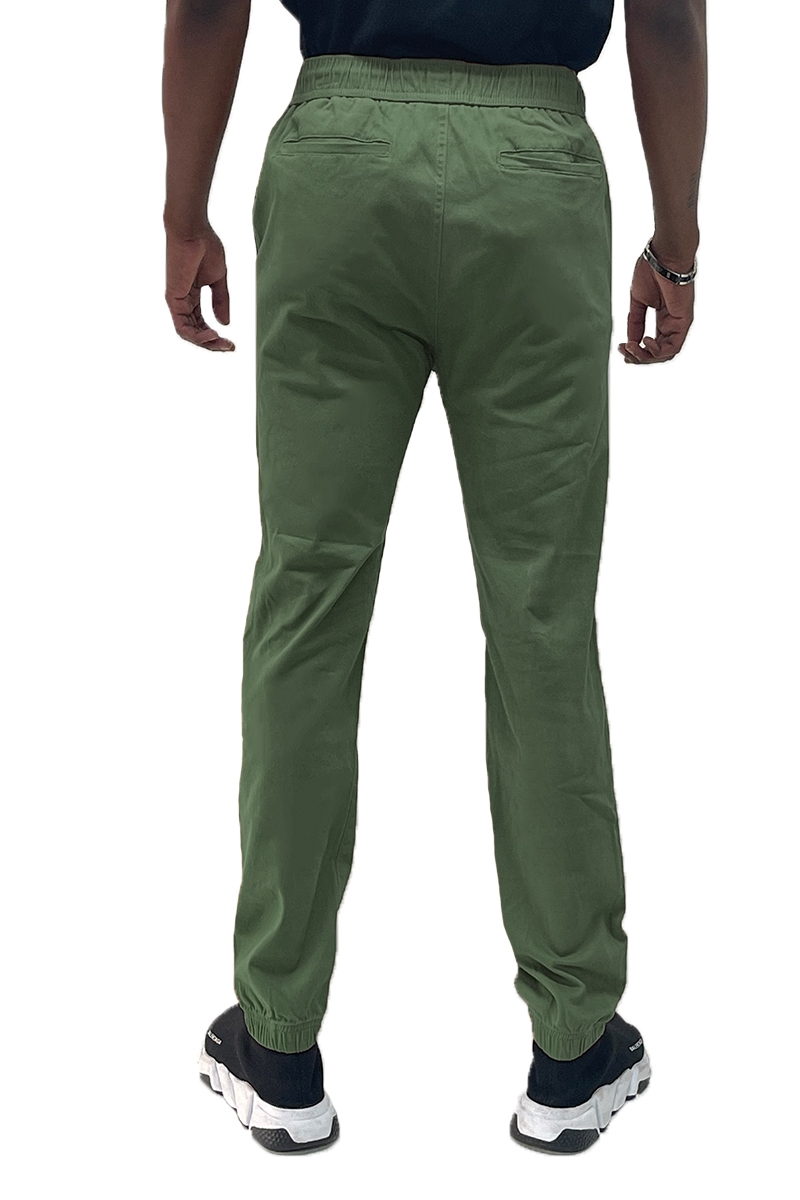 A pair of stylish Solid Jogger Pants featuring an elastic waist and ankle, with standard and back pockets, made from soft cotton blend fabric.