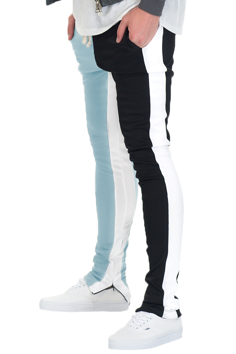 A pair of stylish Split Two Tone Track Pants featuring an elastic waist, drawstring, and hidden ankle zippers, perfect for workouts and casual wear.