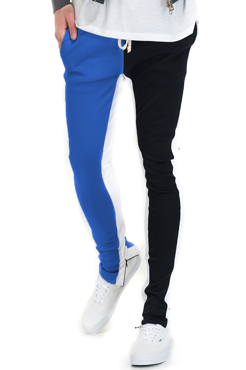 A pair of stylish Split Two Tone Track Pants featuring an elastic waist, hidden ankle zippers, and a modern color-block design.