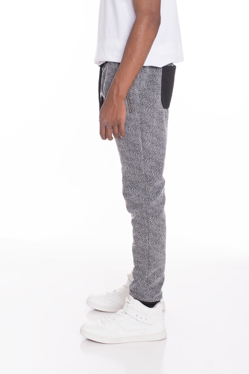 A pair of stylish Static Contrasted Joggers featuring an elastic waist and ankle cuffs, with two standard pockets and a single back pocket.