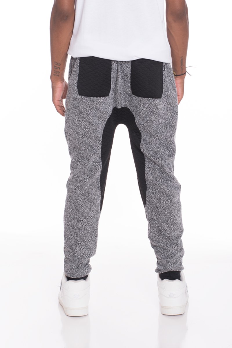 A pair of stylish Static Contrasted Joggers featuring an elastic waist and ankle cuffs, with two standard pockets and a single back pocket.