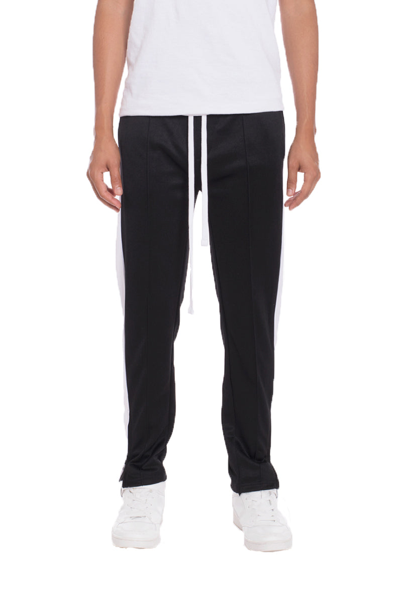 A pair of stylish Tricot Sweat Pants in a regular fit, featuring standard front and back pockets, and a hidden ankle zipper for added convenience.