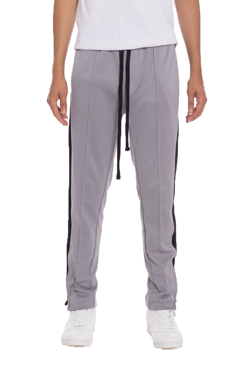 A pair of stylish Tricot Sweat Pants in a regular fit, featuring standard front and back pockets, and a hidden ankle zipper for added convenience.