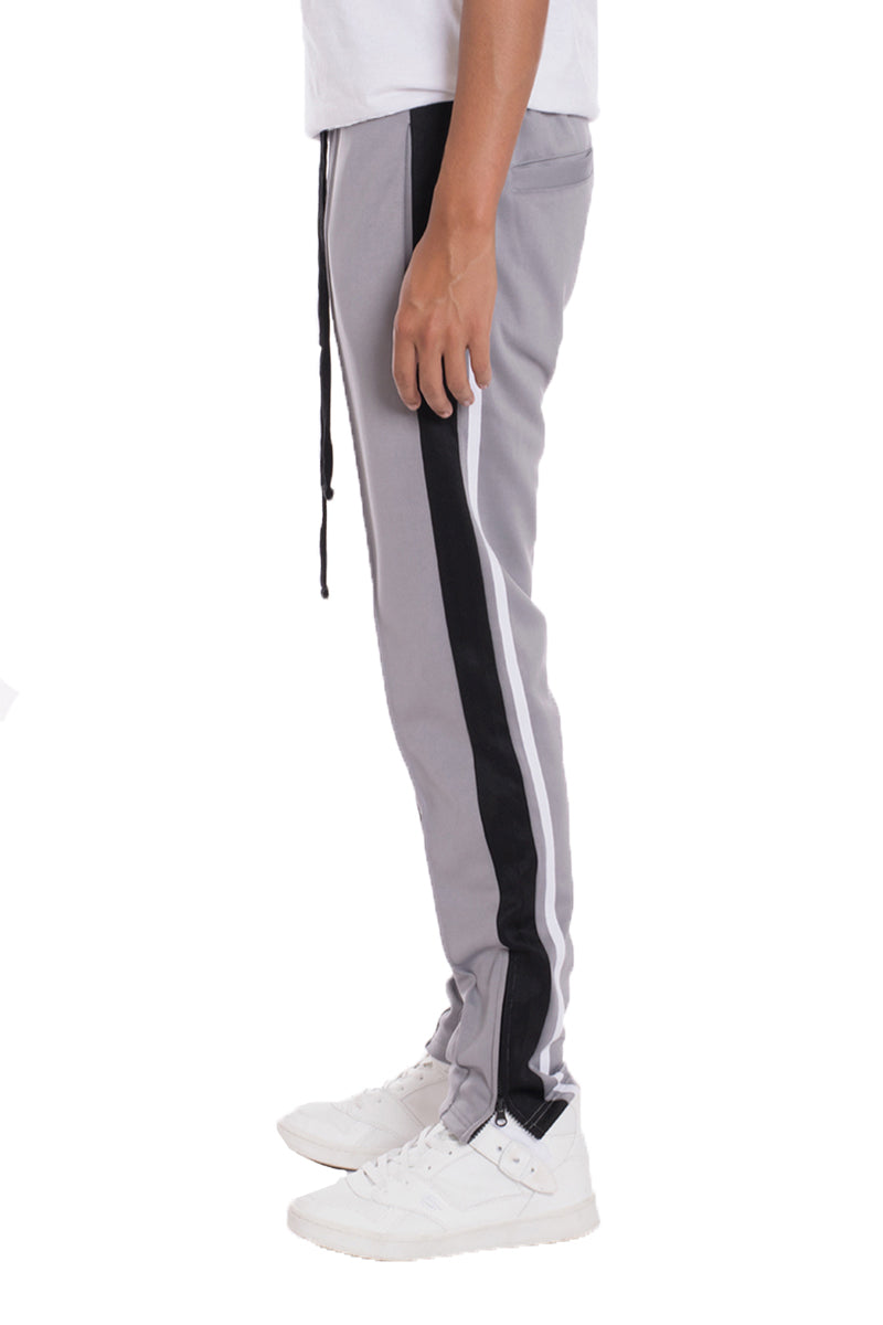 A pair of stylish Tricot Sweat Pants in a regular fit, featuring standard front and back pockets, and a hidden ankle zipper for added convenience.