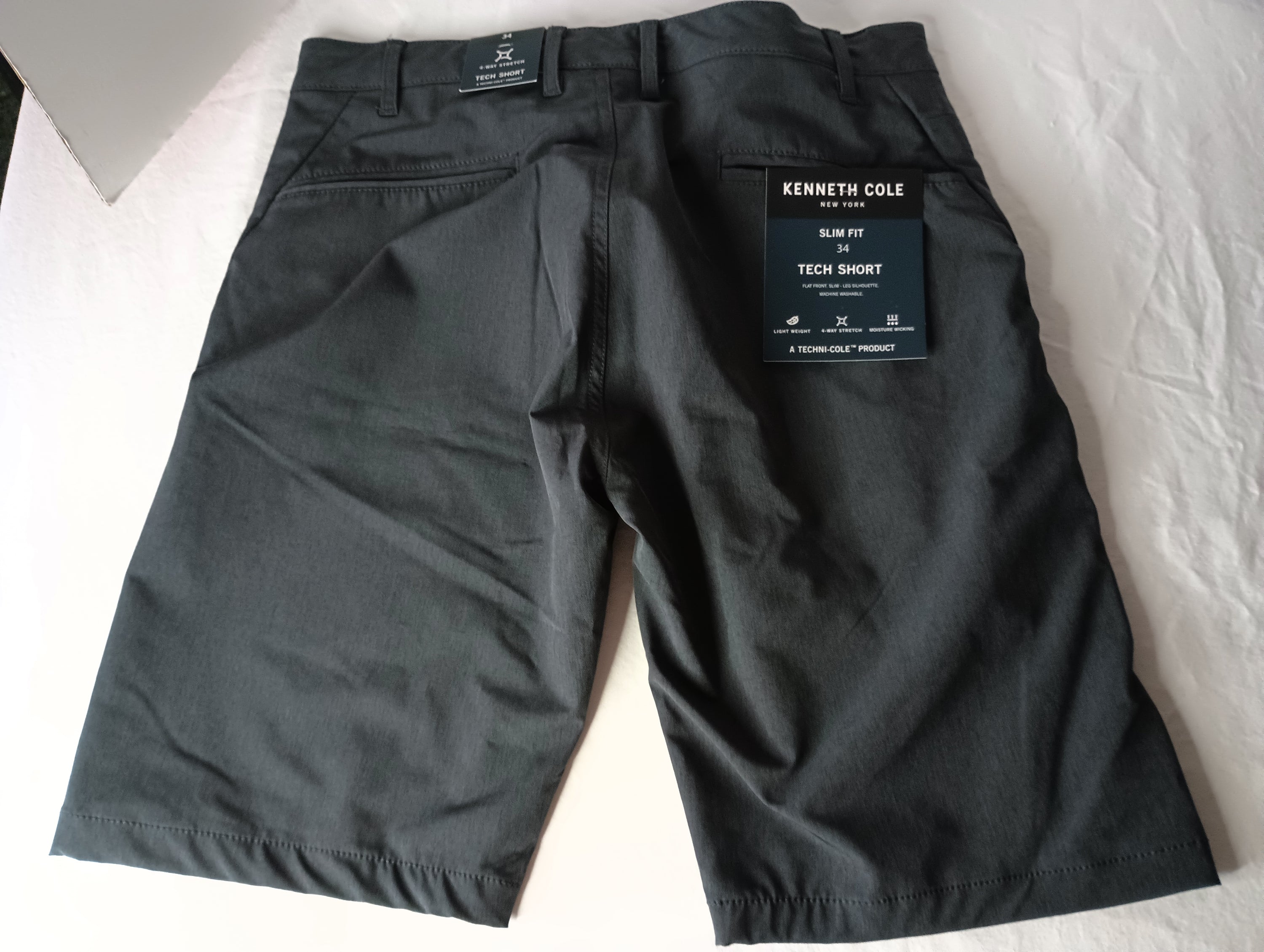 Black Heather Kenneth Cole Tech Shorts in slim fit with hidden pocket and moisture-wicking fabric, perfect for active lifestyles.