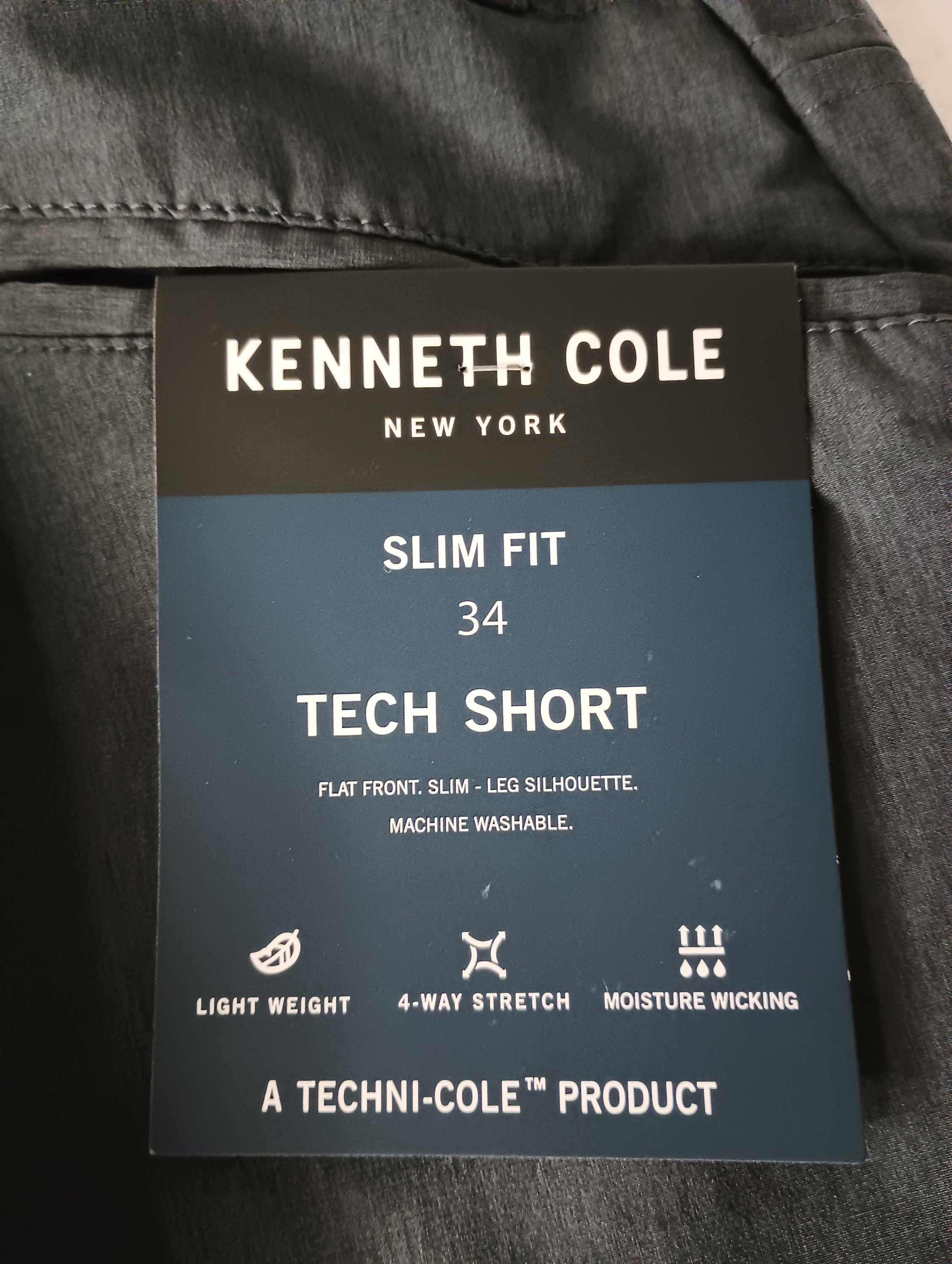 Black Heather Kenneth Cole Tech Shorts in slim fit with hidden pocket and moisture-wicking fabric, perfect for active lifestyles.