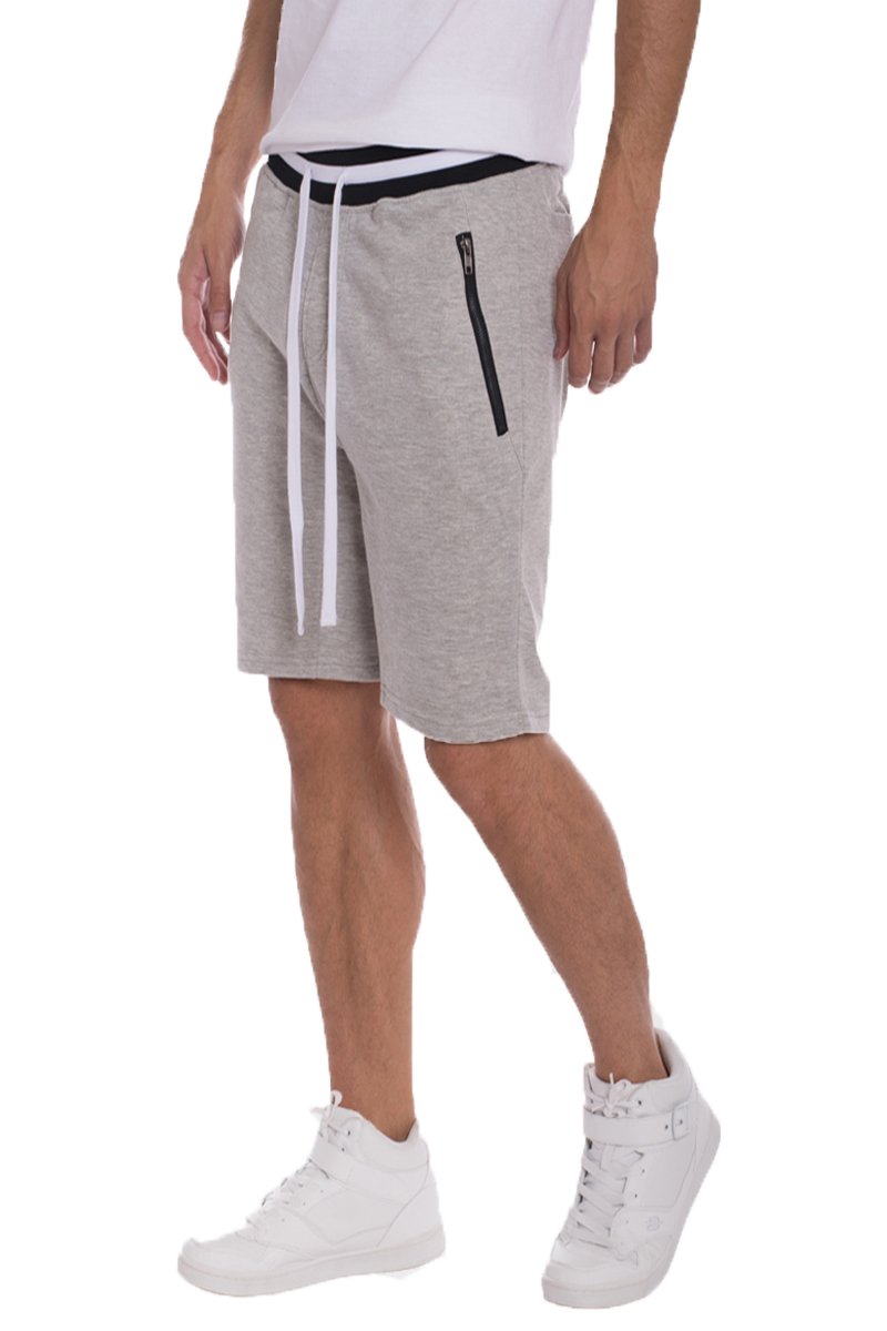 Brandon French Terry Shorts in Grey featuring striped ribbing, zipper pockets, and a black drawstring for a stylish and comfortable fit.