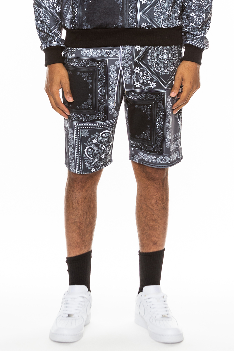 A pair of vibrant paisley all over print shorts featuring an elastic waist and drawstring, perfect for summer wear.