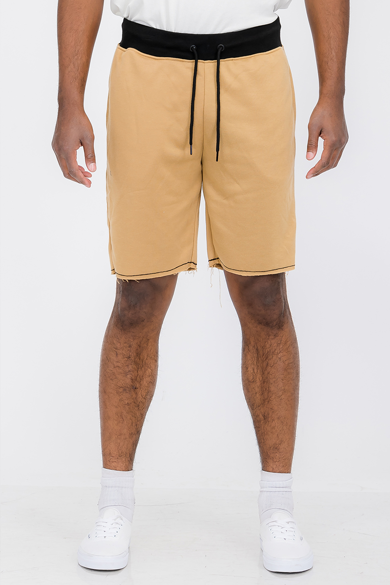 A pair of Raw Cut City Sweat Shorts in a stylish design, featuring an elastic waist with drawstring and a single back pocket.