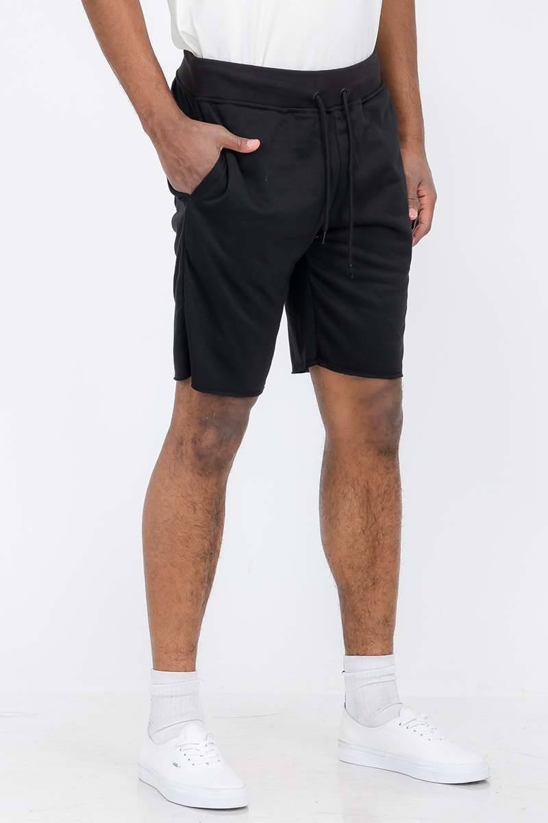 A pair of Raw Cut City Sweat Shorts in a stylish design, featuring an elastic waist with drawstring and a single back pocket.