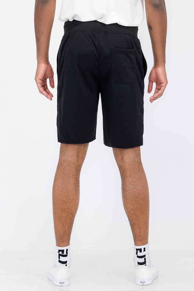 A pair of Raw Cut City Sweat Shorts in a stylish design, featuring an elastic waist with drawstring and a single back pocket.