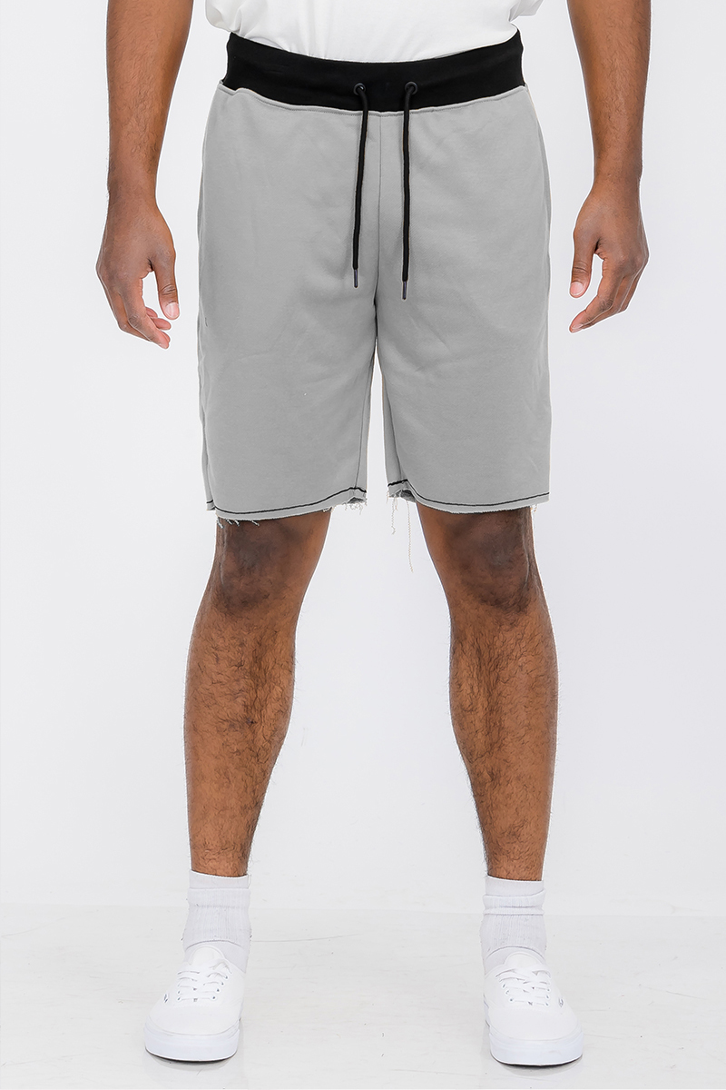 A pair of Raw Cut City Sweat Shorts in a stylish design, featuring an elastic waist with drawstring and a single back pocket.