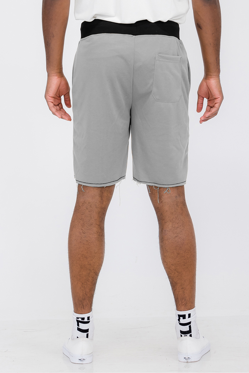 A pair of Raw Cut City Sweat Shorts in a stylish design, featuring an elastic waist with drawstring and a single back pocket.