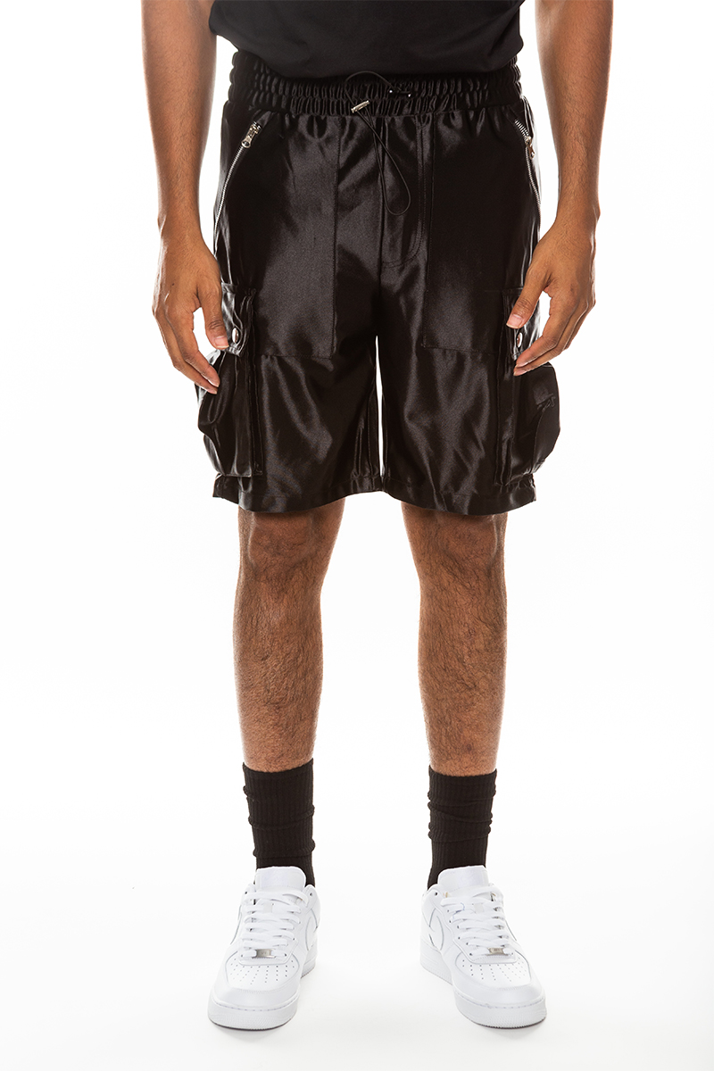 A pair of stylish satin cargo shorts featuring an elastic waist, drawstring, and multiple pockets in a sleek design.