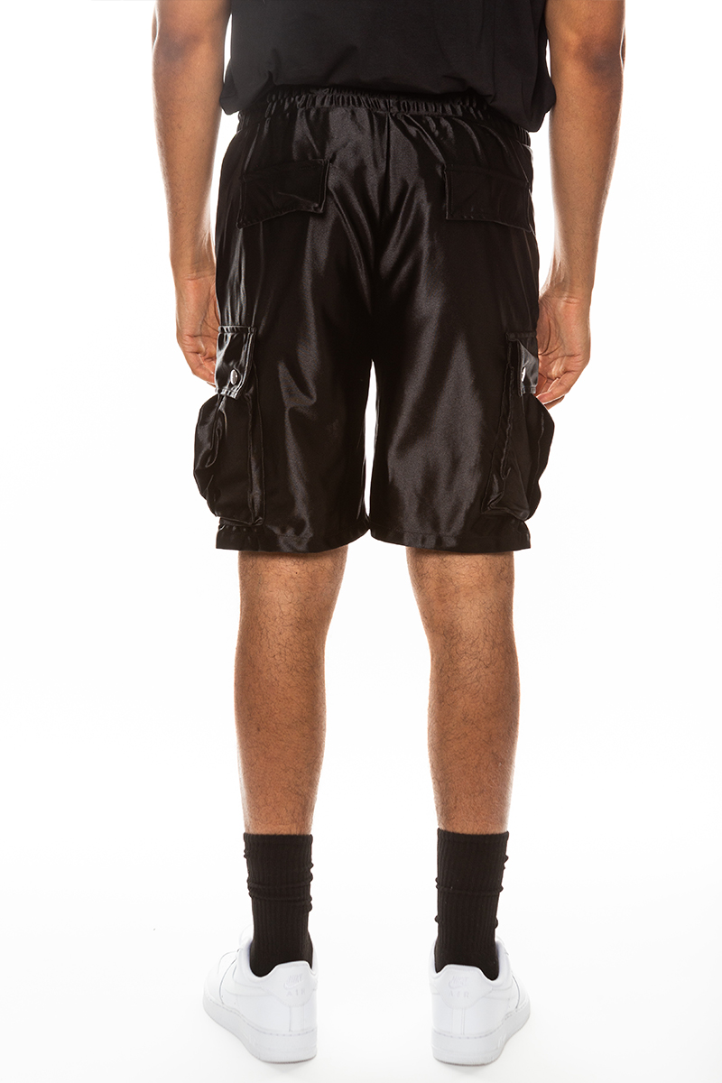 A pair of stylish satin cargo shorts featuring an elastic waist, drawstring, and multiple pockets in a sleek design.