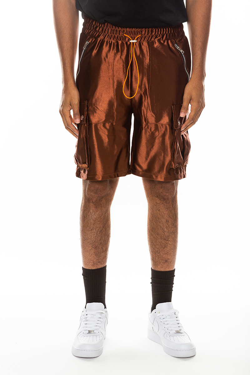 A pair of stylish satin cargo shorts featuring an elastic waist, drawstring, and multiple pockets in a sleek design.