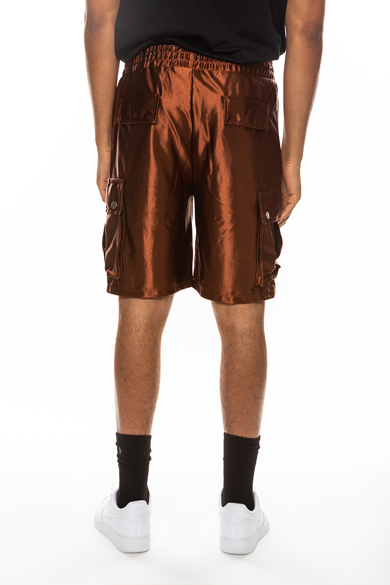 A pair of stylish satin cargo shorts featuring an elastic waist, drawstring, and multiple pockets in a sleek design.