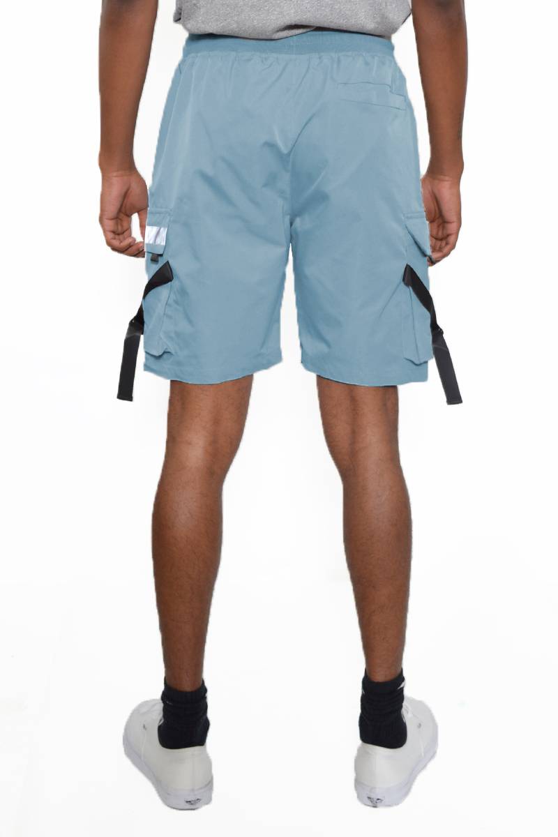 A pair of tactical cargo shorts featuring reflective tape, multiple cargo pockets, and an elastic waist with drawstring, ideal for outdoor activities.