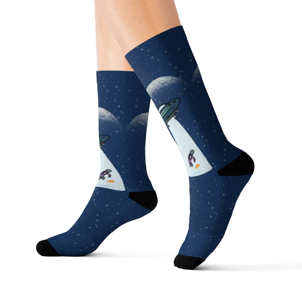 A pair of novelty socks featuring aliens and a slice of pizza, showcasing vibrant colors and a fun design.