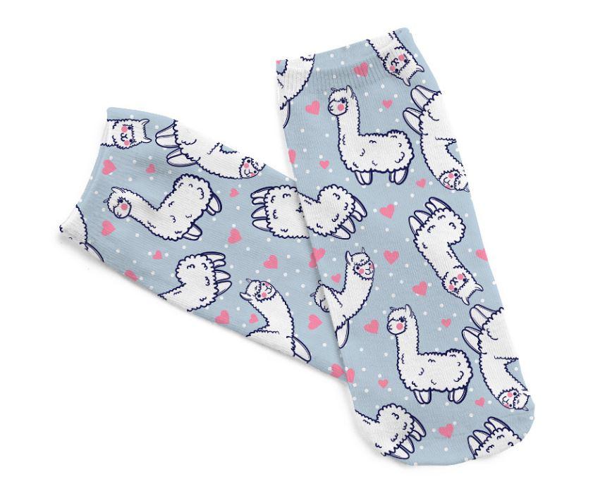 A pair of cute Alpaca Dreams of Love socks featuring an adorable alpaca design, made from a soft cotton/polyester blend, suitable for women and kids.