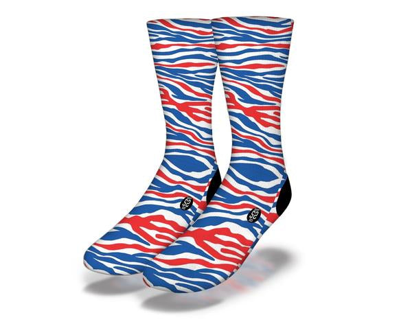 A pair of vibrant blue and red zebra striped fun animal print socks, perfect for animal lovers and quirky fashion enthusiasts.