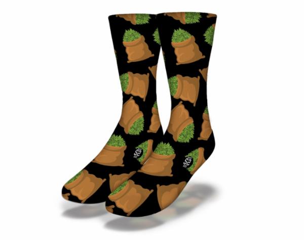 A pair of black fun weed socks featuring a vibrant marijuana pot leaf design, perfect for stoners and as gag gifts.