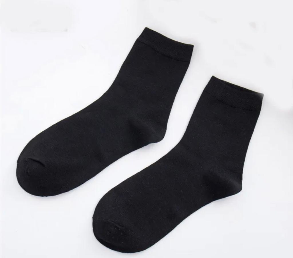 A pack of GK Cotton Blend Men's Dress Socks in black, gray, and blue, showcasing their comfortable and stylish design.