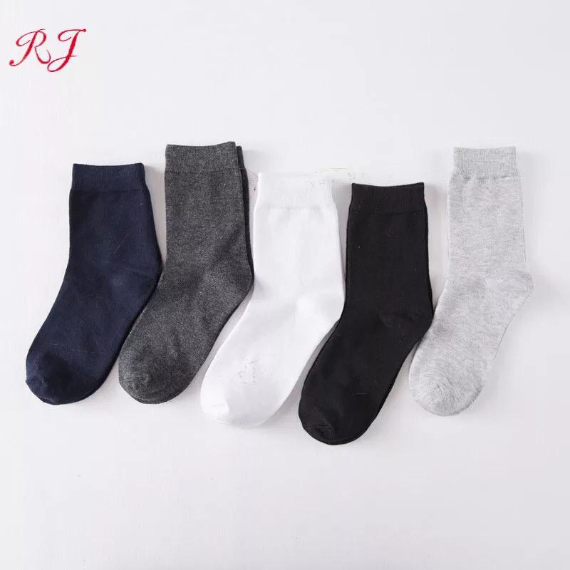 A pack of GK Cotton Blend Men's Dress Socks in black, gray, and blue, showcasing their comfortable and stylish design.