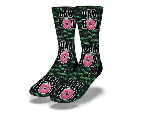 A pair of DAD BOD IN THE TREES Funny Dad Socks featuring a humorous design, perfect for 420-friendly fathers.