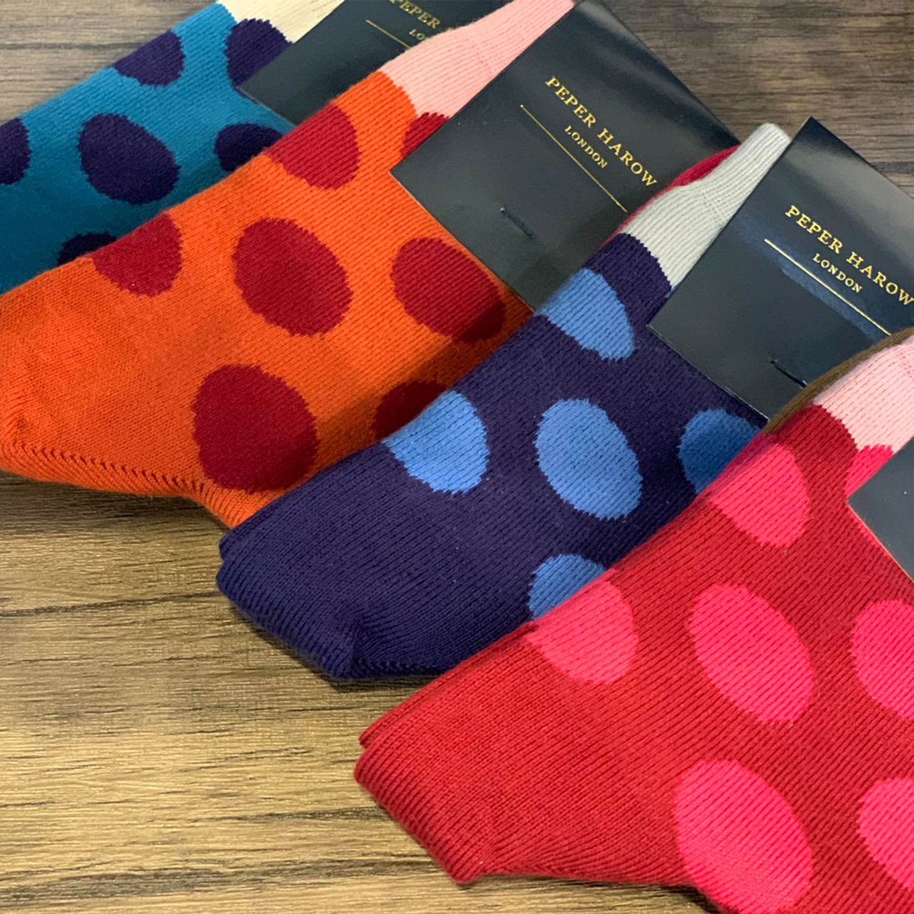 Eleanor Women's Navy Socks featuring blue polka dots and a pink toe, made from luxurious Supima cotton.