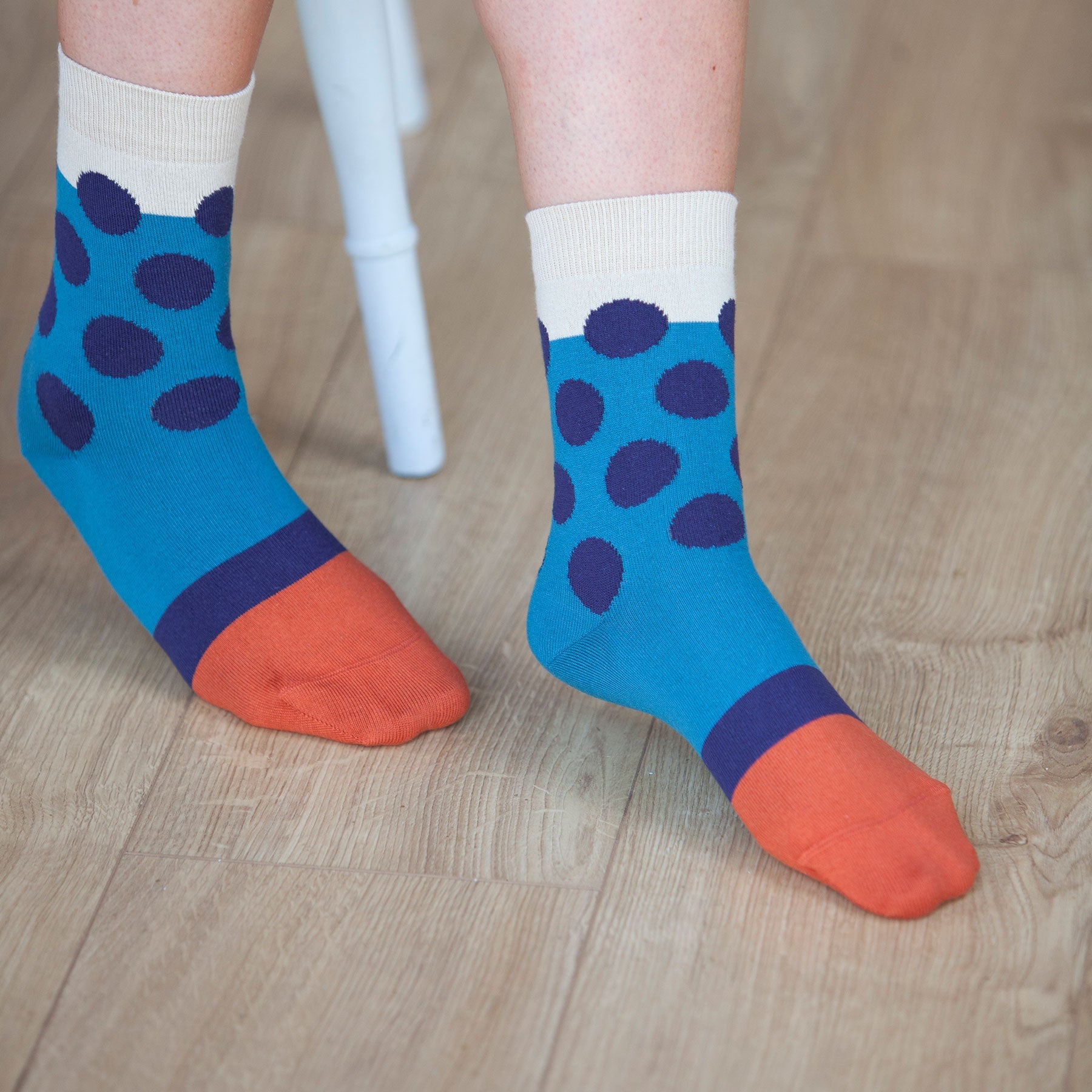 Eleanor Women's Socks in teal with navy polka dots and burnt orange toe, showcasing luxurious Supima cotton material.