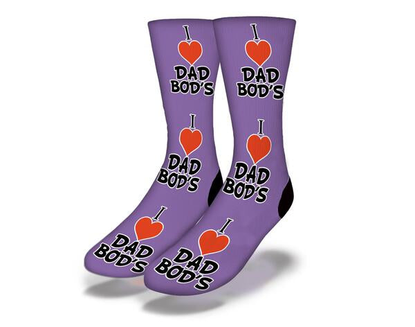 Purple socks with the phrase 'I LOVE DAD BODS' designed for humor and comfort, perfect for gifting.