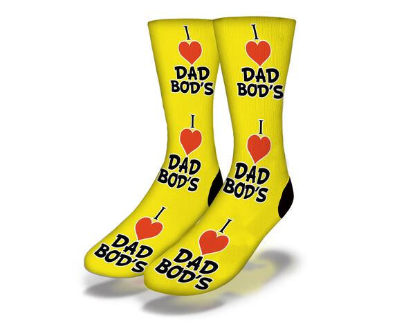 Bright yellow socks with a humorous 'I LOVE DAD BODS' design, perfect for gifting and casual wear.