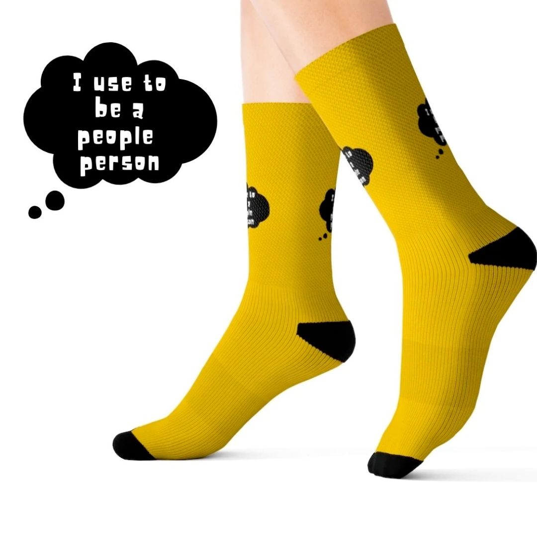 A pair of I Use To Be a People Person funny novelty socks featuring a humorous print, designed for comfort and style.