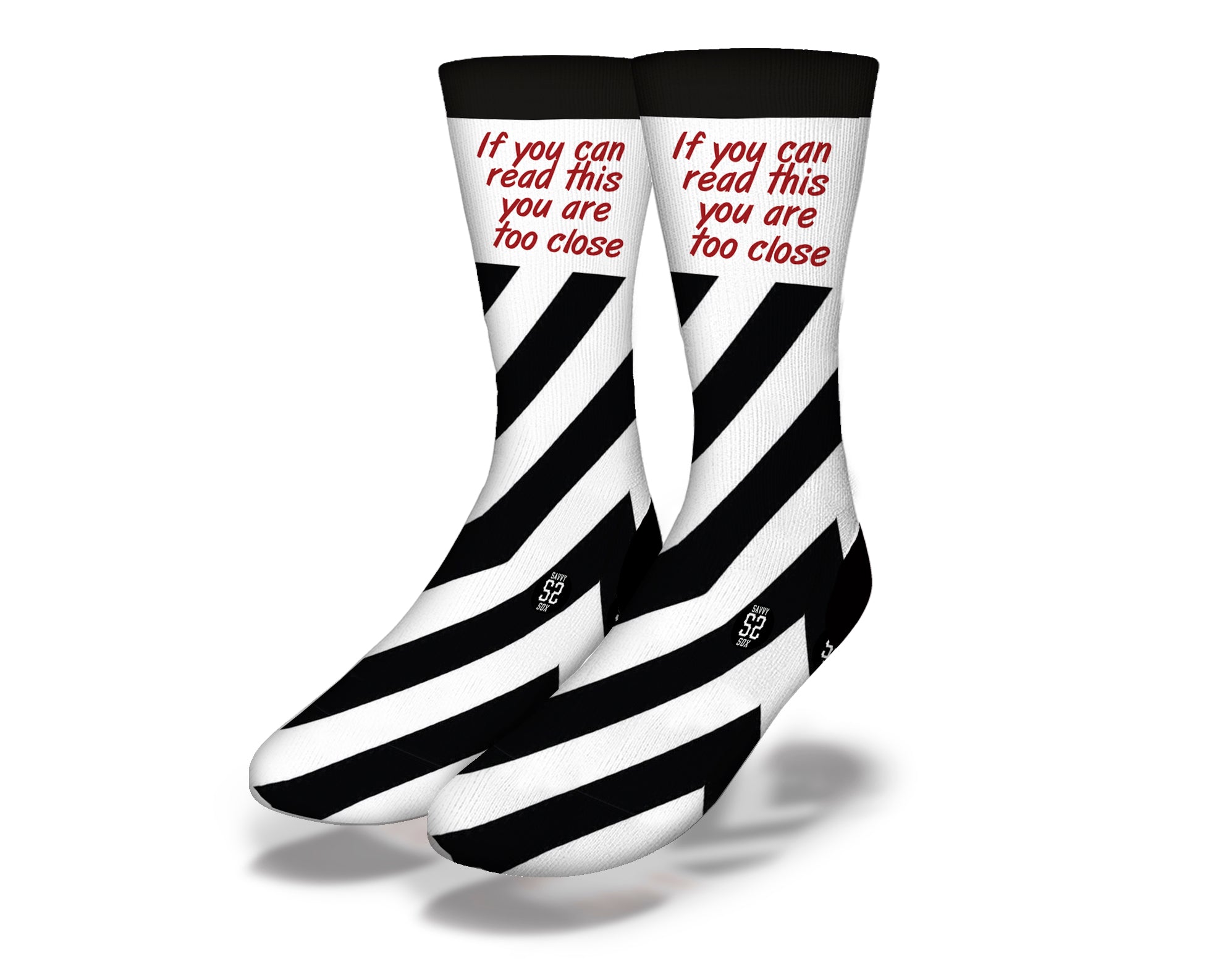 A pair of cozy socks with the phrase 'If You're Reading This' printed on them, showcasing a fun and unique design.