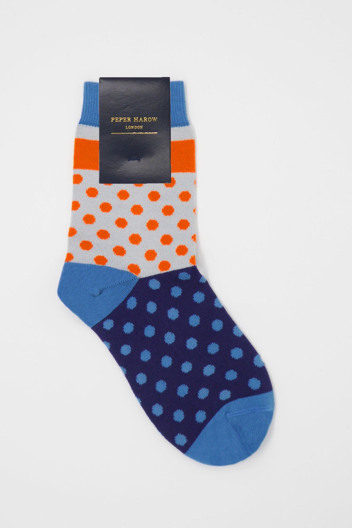 Katherine Women's Socks in Navy featuring vibrant orange and blue polka dots on a rich navy background, showcasing luxury and style.