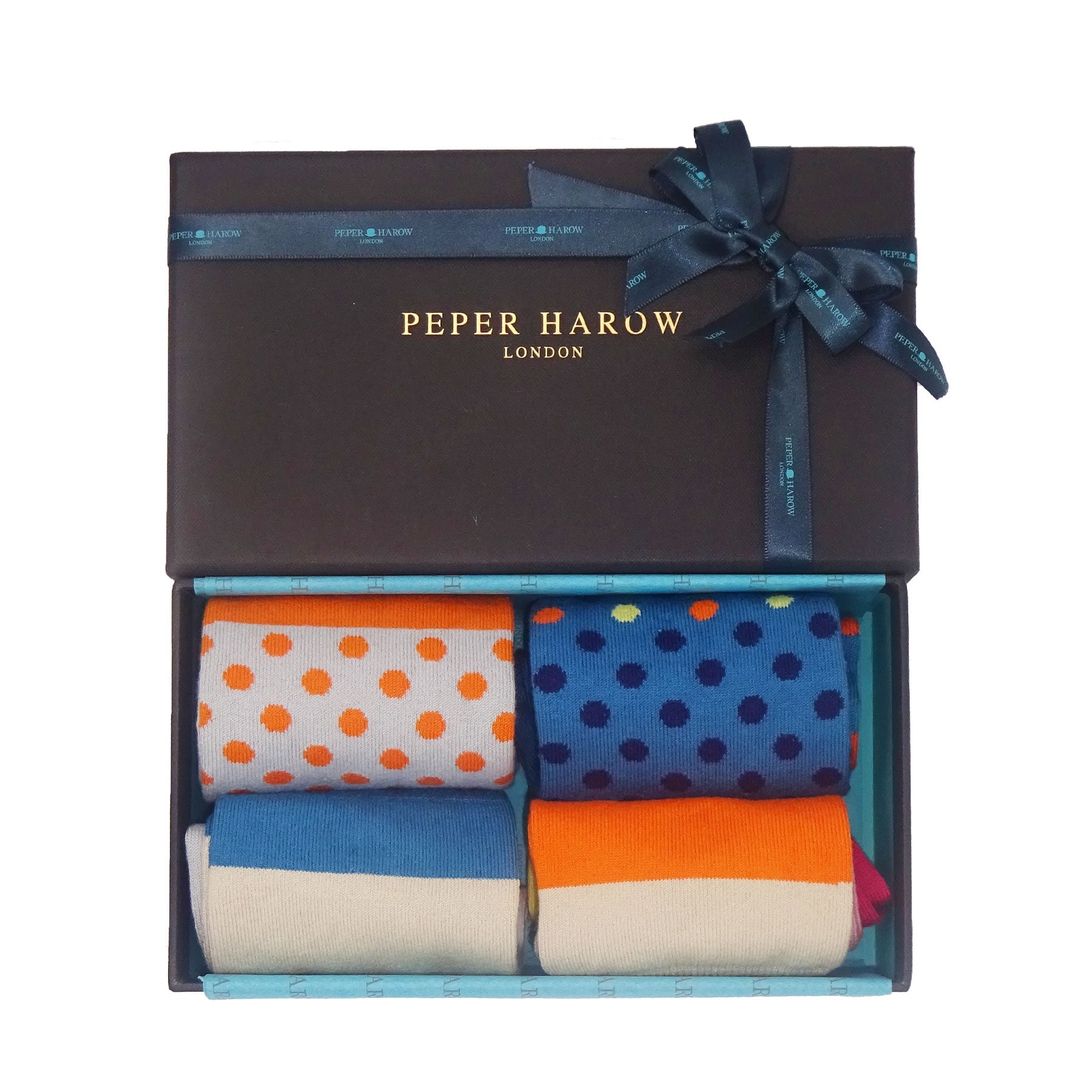 Katherine Women's Socks in Navy featuring vibrant orange and blue polka dots on a rich navy background, showcasing luxury and style.