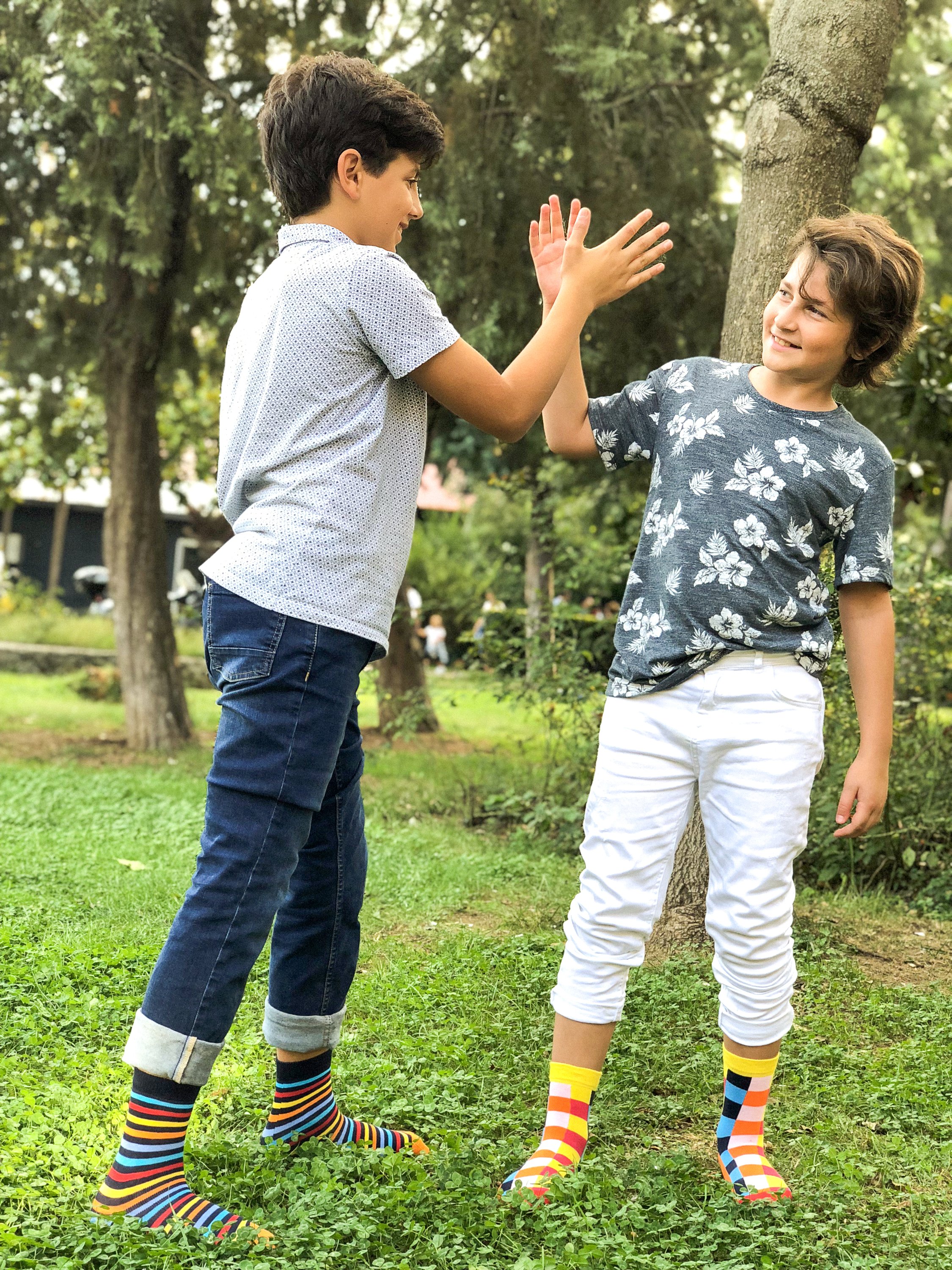 Kids Black Rainbow Stripe Socks featuring vibrant colors and a fun design, made from soft Turkish cotton for comfort and durability.