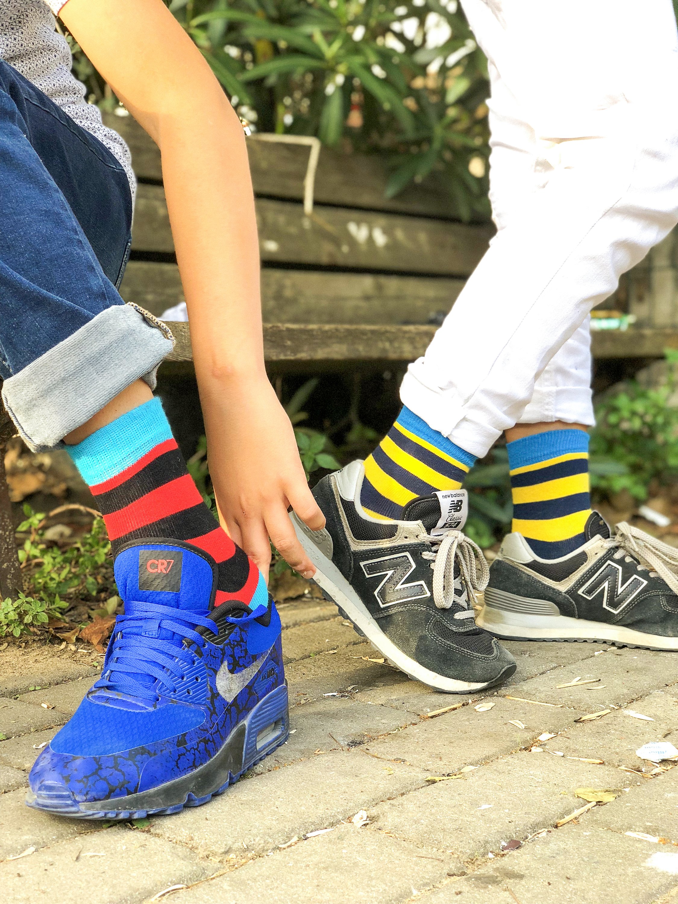 Kids Blue Canary Stripe Socks featuring vibrant blue and yellow stripes, made from soft Turkish cotton for comfort and style.