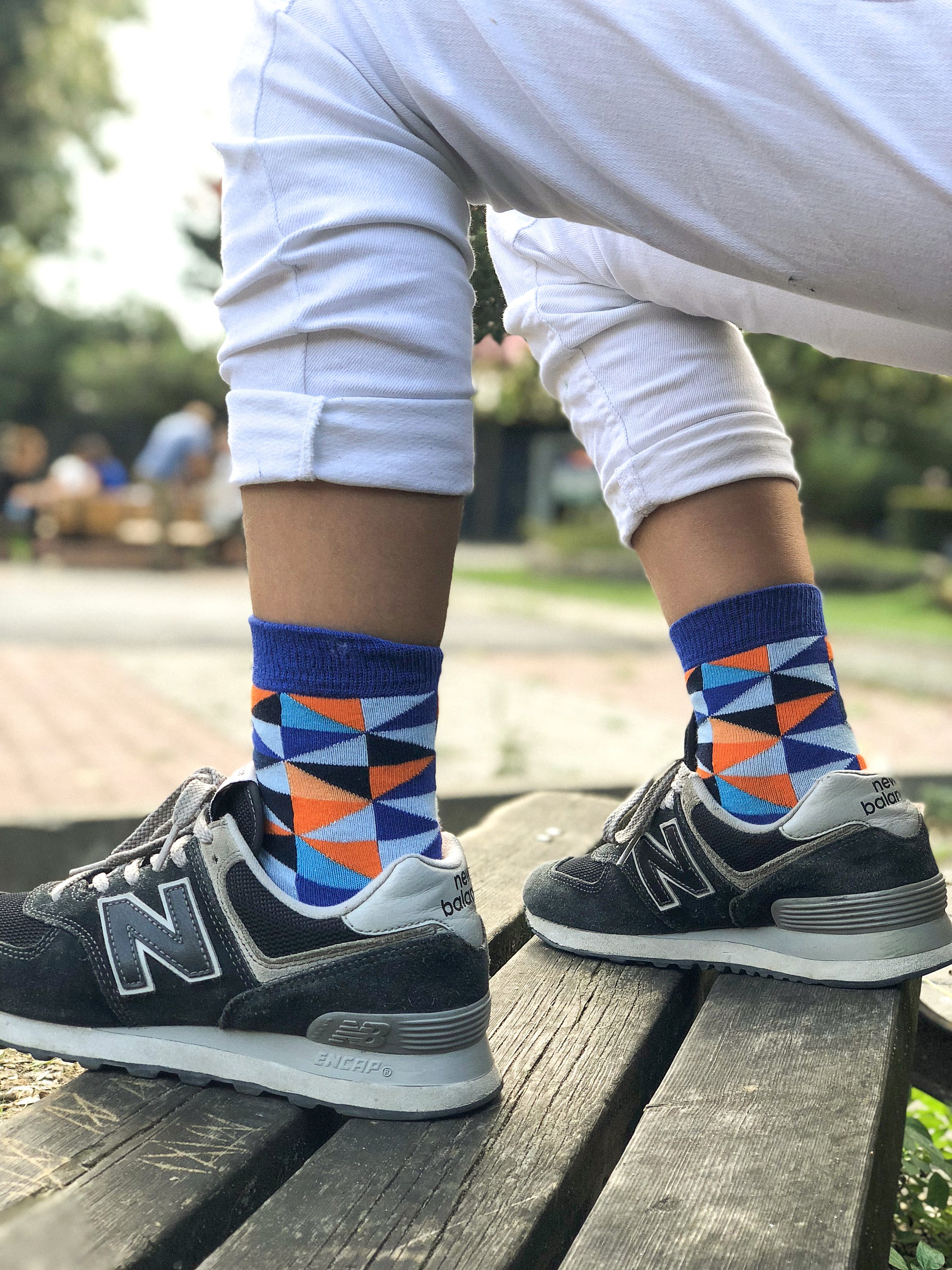 A pair of Kids Blue Triangle Socks featuring a vibrant blue color with a trendy triangle pattern, perfect for adding style to children's outfits.