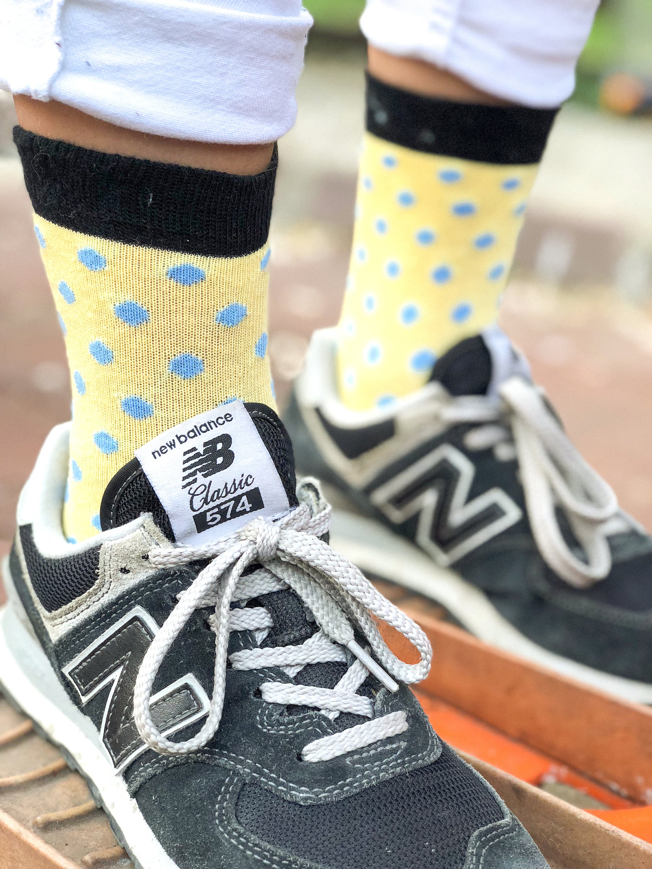 A pair of colorful Kids Buttermilk Dot Socks featuring a fun dot pattern, made from soft Turkish cotton for comfort and style.