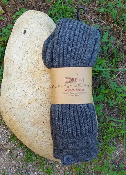 Knee-Hi Alpaca Socks in various colors, showcasing their soft texture and knee-high design, perfect for comfort and warmth.