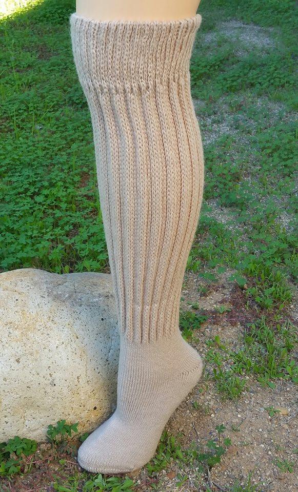 Knee-Hi Alpaca Socks in various colors, showcasing their soft texture and knee-high design, perfect for comfort and warmth.