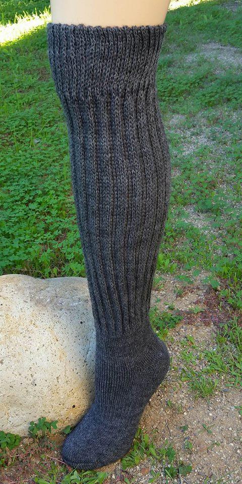 Knee-Hi Alpaca Socks in various colors, showcasing their soft texture and knee-high design, perfect for comfort and warmth.