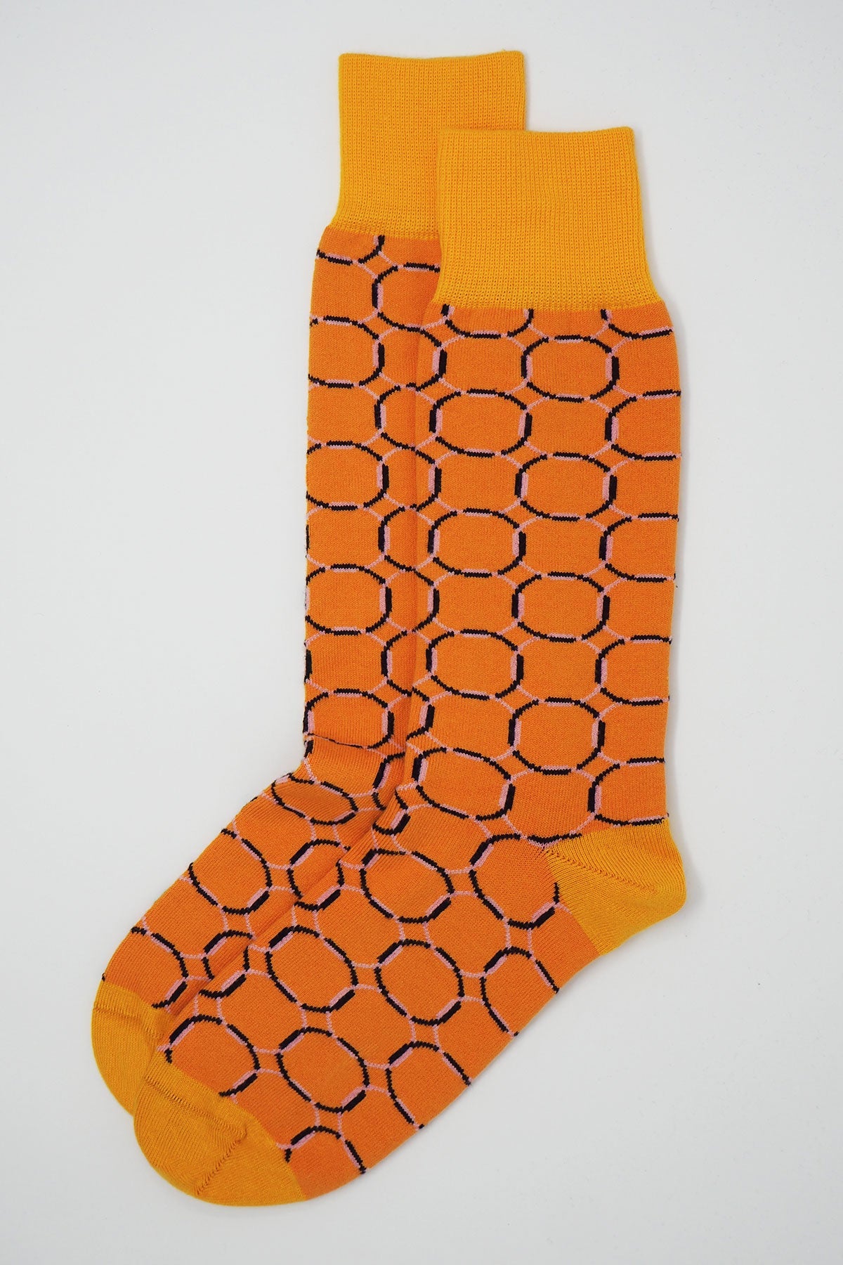 A pair of vibrant orange Linked Men's Socks with a yellow pattern, showcasing luxury and style.